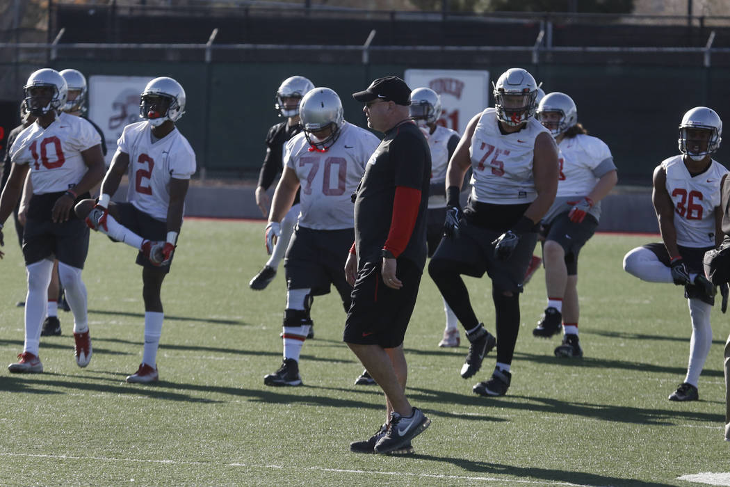 UNLV Rebels head coach Tony Sanchez watches as his players stretch during the first day of spring practice on Tuesday, March 6, 2018, in Las Vegas. Bizuayehu Tesfaye/Las Vegas Review-Journal @bizu ...