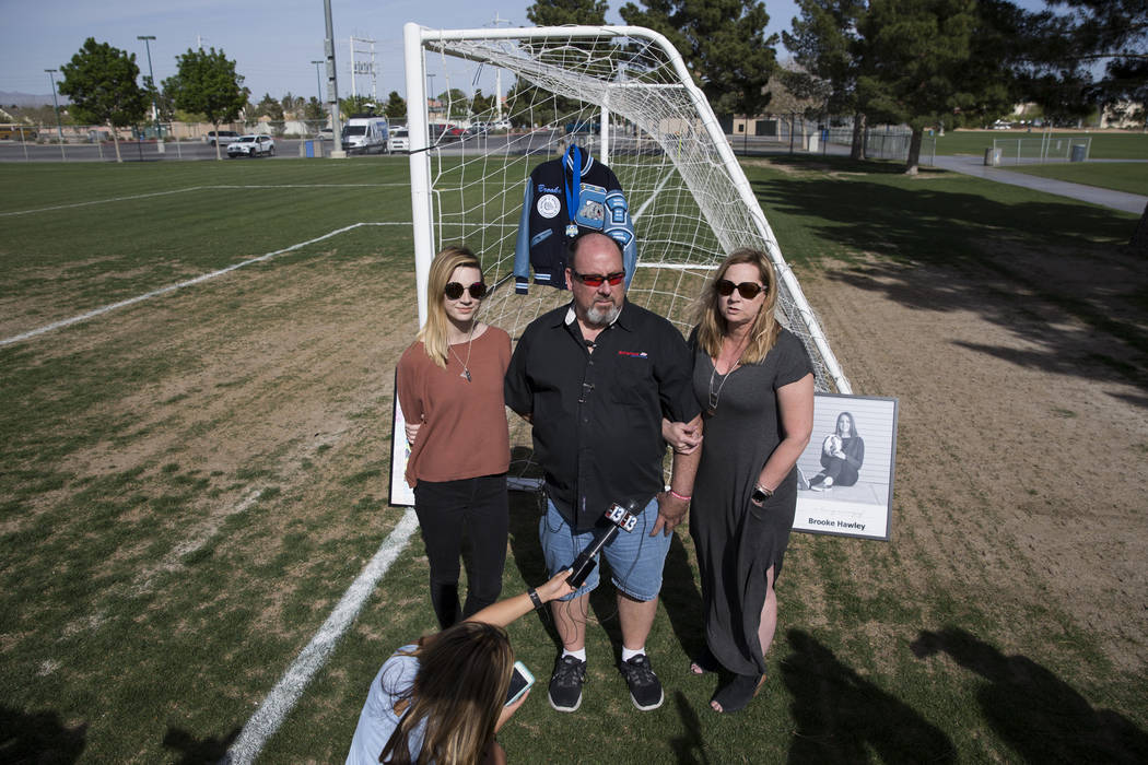 Heather Hawley, left, father Aaron and mother Rhonda speak during a press conference announcing the Brooke Hawley Memorial Scholarship, at the Bettye Wilson Soccer Complex in Las Vegas, Tuesday, A ...