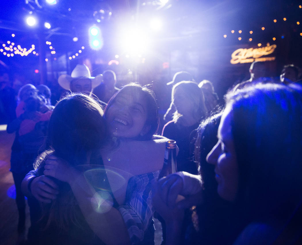 Reanne Pilapil, left, hugs a friend during a benefit show for the victims of the Route 91 shooting at Stoney's Rockin' Country on Wednesday, October 4, 2017, in Las Vegas.  Benjamin Hager Las Vega ...