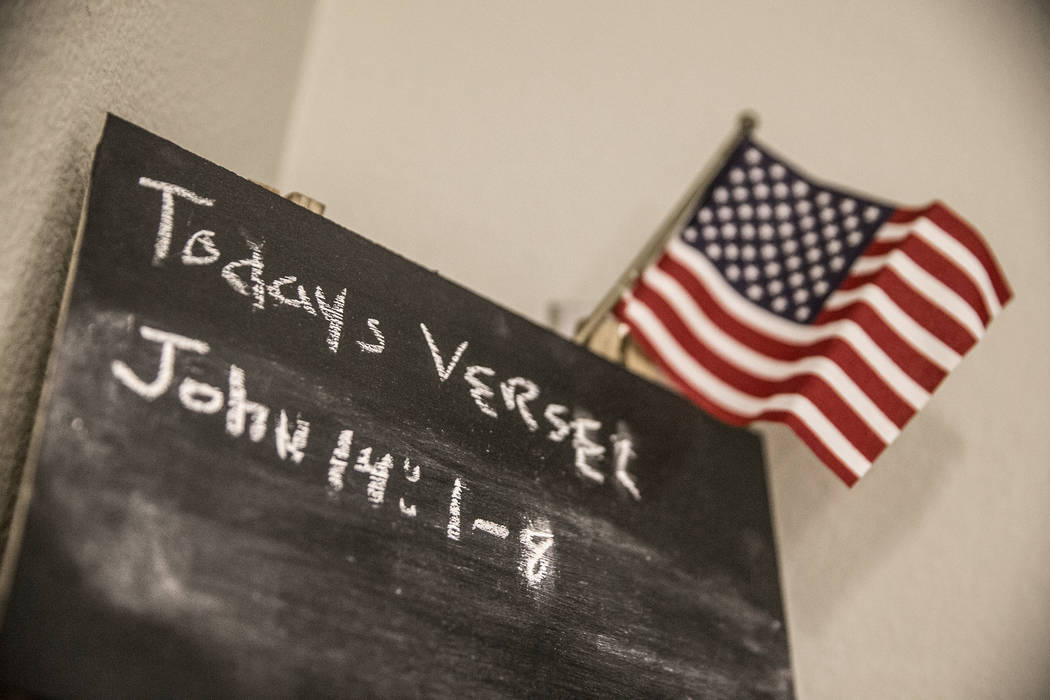A chalk board referencing the bible verses John 14:1-8 outside a unit at Patriot Place Apartments on Tuesday, April 17, 2018, in Las Vegas. Patriot Place Apartments is an affordable housing facili ...