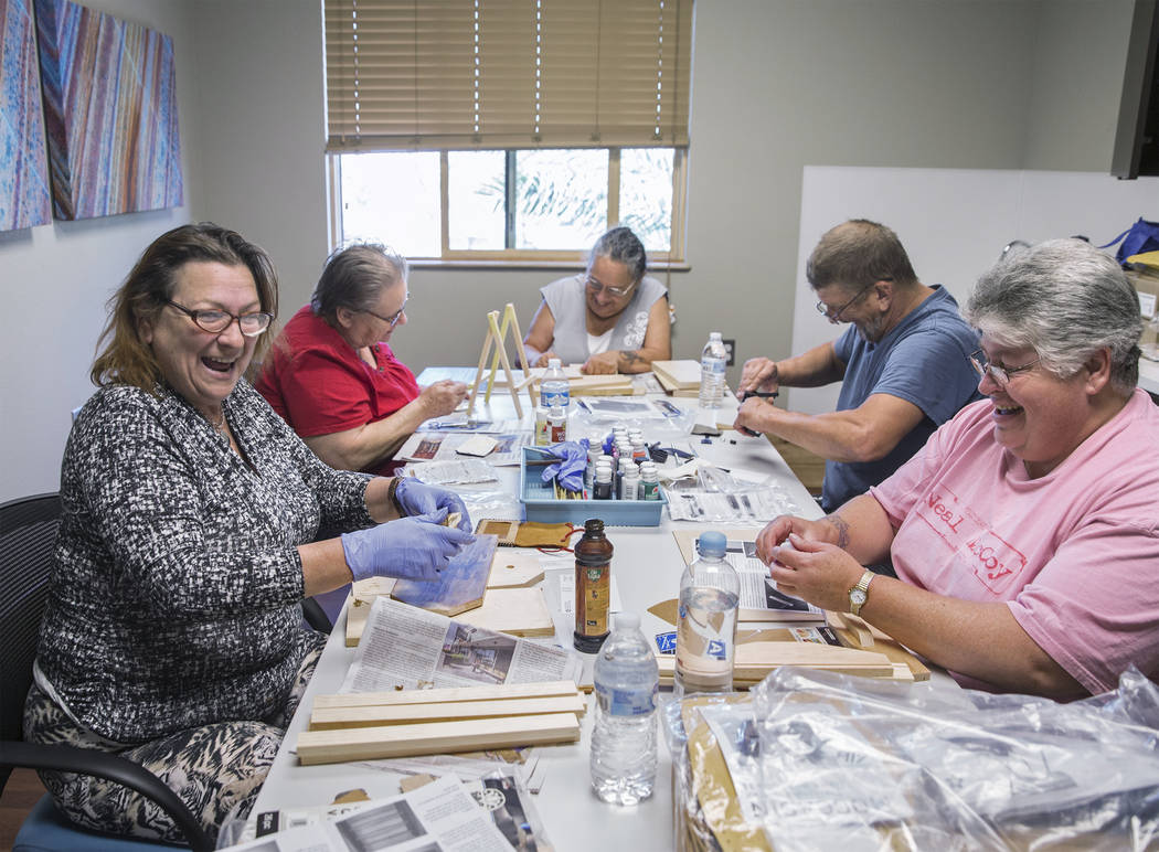 Clyda Byrd-Lopez, left, Carol Ambrose, Debbie Lara, William Bryant and Michele Marshall socialize while crafting on Tuesday, April 17, 2018, at Patriot Place Apartments, in Las Vegas. Patriot Plac ...