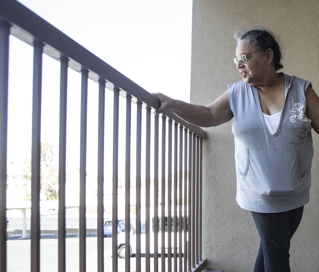 Army veteran Debbie Lara looks out into the courtyard from the porch of her new one bedroom, furnished apartment on Tuesday, April 17, 2018, at Patriot Place Apartments, in Las Vegas. Patriot Plac ...