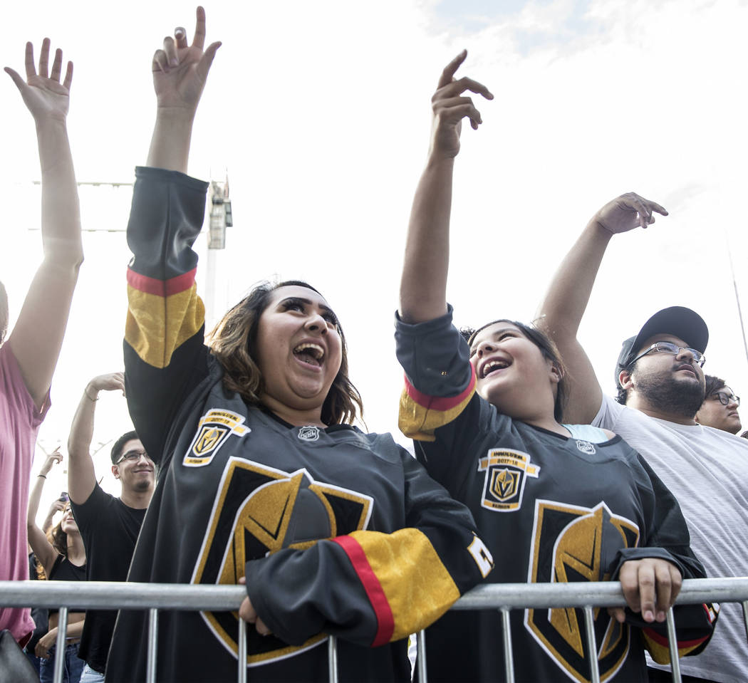 Fans cheer for rapper Logic outside T-Mobile Arena before the start of the Golden Knights first round playoff game with the Los Angeles Kings at Toshiba Plaza on Wednesday, April 11, 2018, in Las  ...
