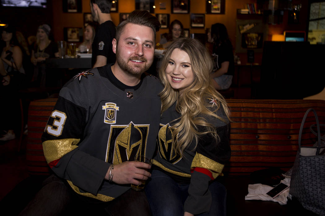 Golden Knights fans Chaisson and Devan Prescott, who were both born in Vegas and met in high school, prior to the start of the team's first playoff game at Born and Raised in southwest Las Vegas o ...