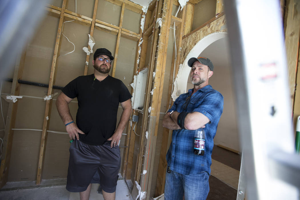Louie DeSangro, left, owner of West Coast Build and Design, and David Shick, veteran and sponsors relations officer for Guns to Hammers, at the home of Ed Wiesing in Las Vegas, Thursday, April 12, ...