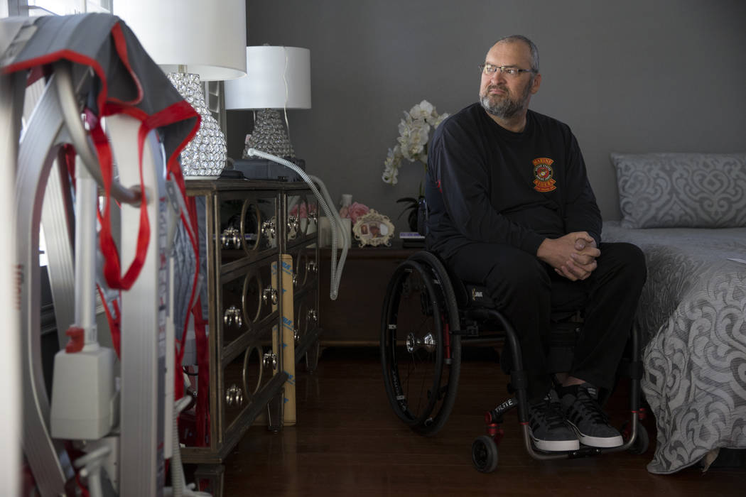 Military veteran Ed Wiesing at his Las Vegas home, Thursday, April 12, 2018. Wiesing underwent a surgical procedure last year that left him paralyzed from his legs. The veteran support group Guns ...