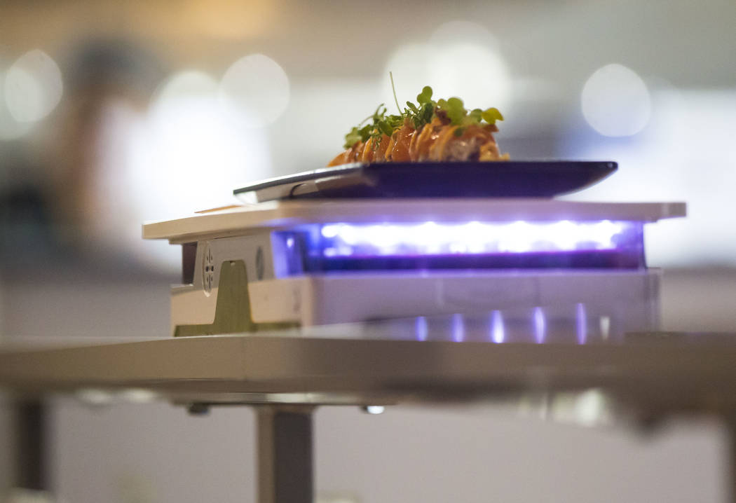 A Sapporo garlic salmon roll arrives via a robotic cart at Sapporo Revolving Sushi in Las Vegas on Wednesday, April 25, 2018. Chase Stevens Las Vegas Review-Journal @csstevensphoto