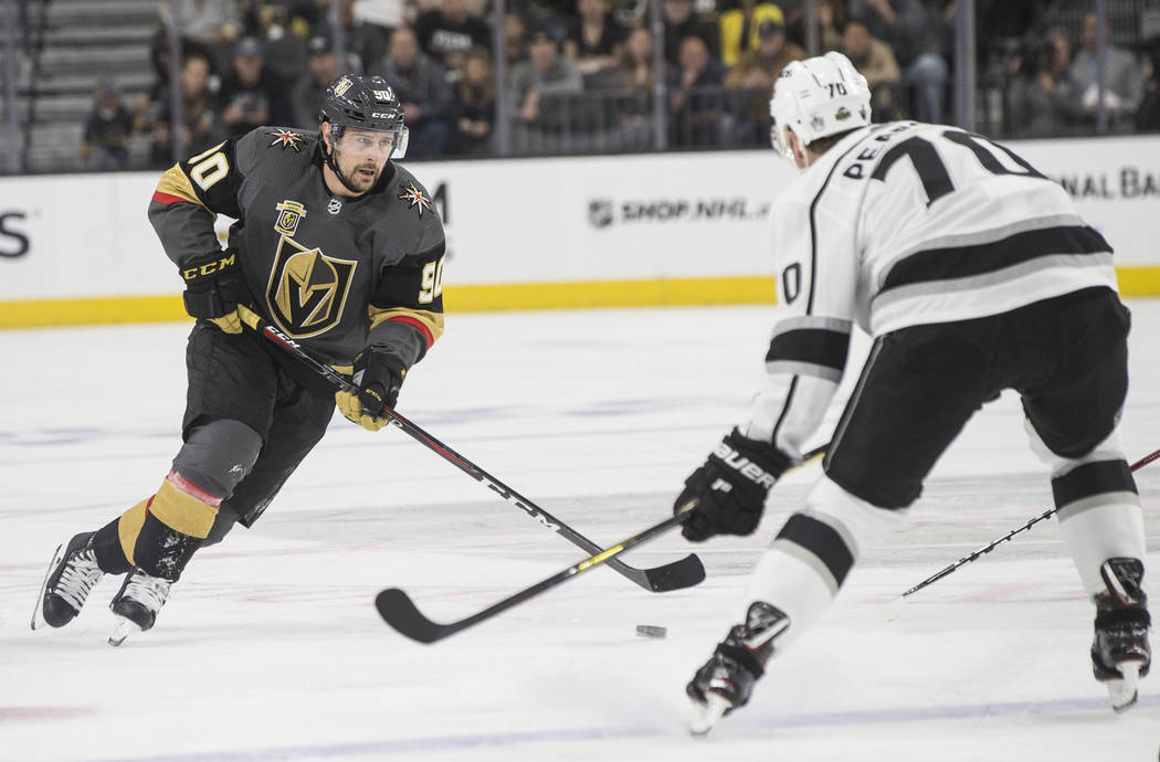Golden Knights left wing Tomas Tatar (90) moves the puck up ice against Los Angeles Kings left wing Tanner Pearson (70) in the first period of game two of their first-round playoff series on Frida ...