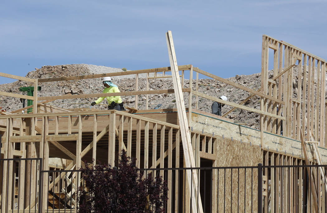 Construction workers put up new homes at the Cove at Southern Highlands and St. Rose parkways on Wednesday, April 18, 2018, in Las Vegas. Bizuayehu Tesfaye/Las Vegas Review-Journal @bizutesfaye
