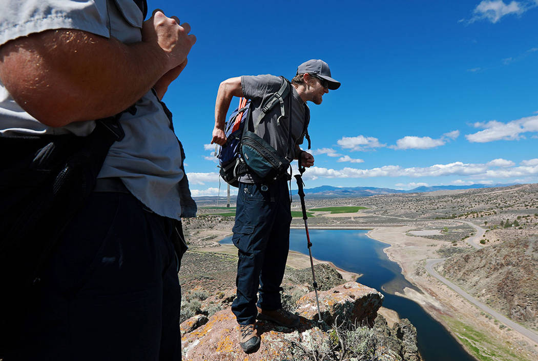 Joe Barnes, a biologist with the Nevada Department of Wildlife, looks for a pair of golden eagl ...