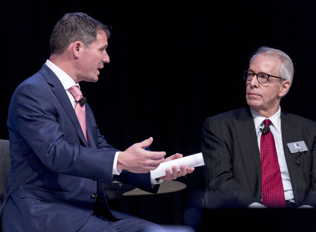 President and CEO of the American Gaming Association Geoff Freeman leads a panel discussion with gaming leaders including, Everi president Michael D. Rumbolz, right, at the Special Events Stage at ...