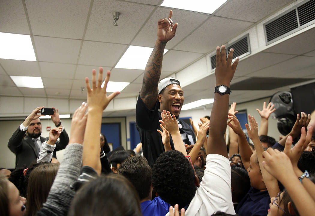 Oakland Raiders player Bruce Irvin huddles with students at Gene Ward elementary school in Las Vegas, Wednesday, May 9, 2018. Students participated in a raiders themed drawing contest. Rachel Asto ...