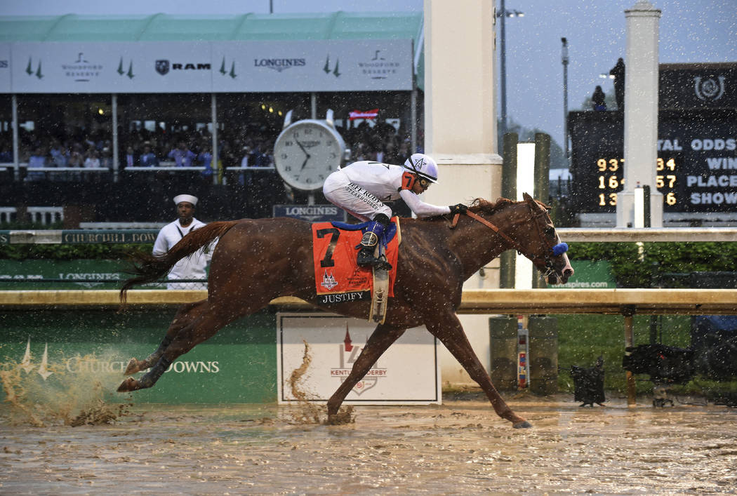 IMAGE DISTRIBUTED FOR LONGINES - Justify, ridden by jockey Mike Smith, wins the 144th Kentucky Derby, the wettest in history, on Saturday, May 5, 2018, at Churchill Downs in Louisville, Ky. Longin ...