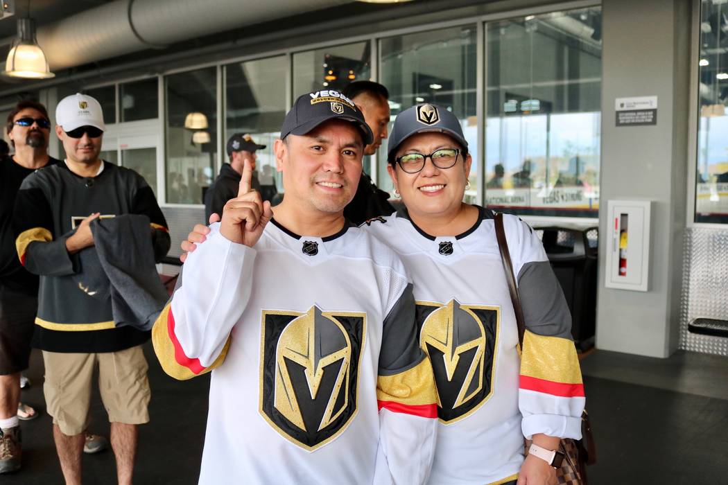 Golden Knights fans Manny, left, and Trixie Olivo sport their jerseys in line in to buy merchandise from The Arsenal Pro Shop at City National Arena in Las Vegas, Monday, May 21, 2018. They were h ...