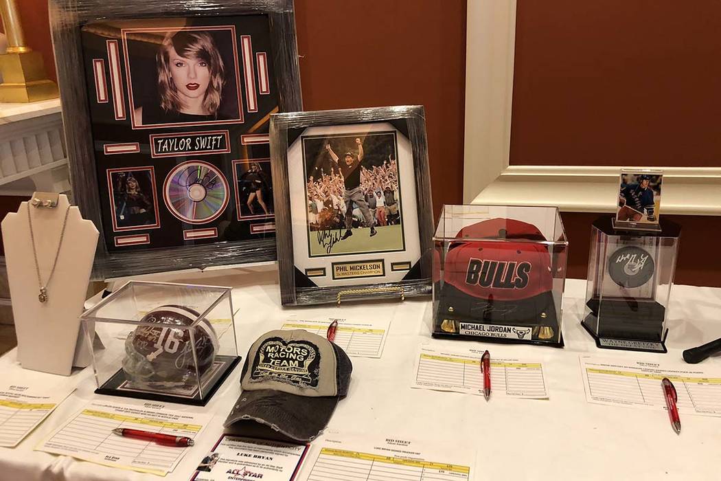 Signed memorabilia from a silent auction at the National Investor Relations Institute's annual conference. The silent auction raised $10,000 for Route 91 Strong, a nonprofit supporting survivors o ...