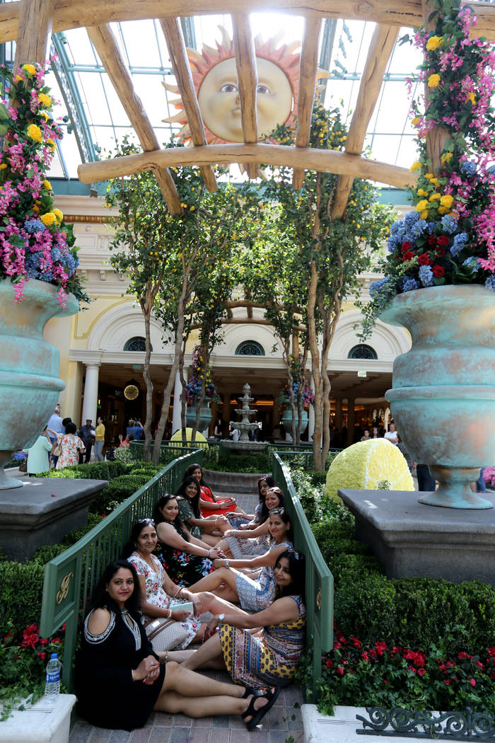 Friends from Owensboro, Ky. and Toledo, Ohio pose at ÒThatÕs AmorŽ,Ó the Bellagio Conservatory's summer display Monday, June 18, 2018. The display, based on an Italian summer, ...
