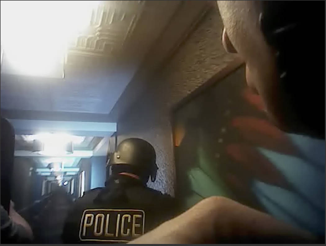 This still image taken from police officer body-camera video footage on Oct. 1, 2017, provided by the Las Vegas Metropolitan Police Department, shows officers searching hallways during the deadlie ...