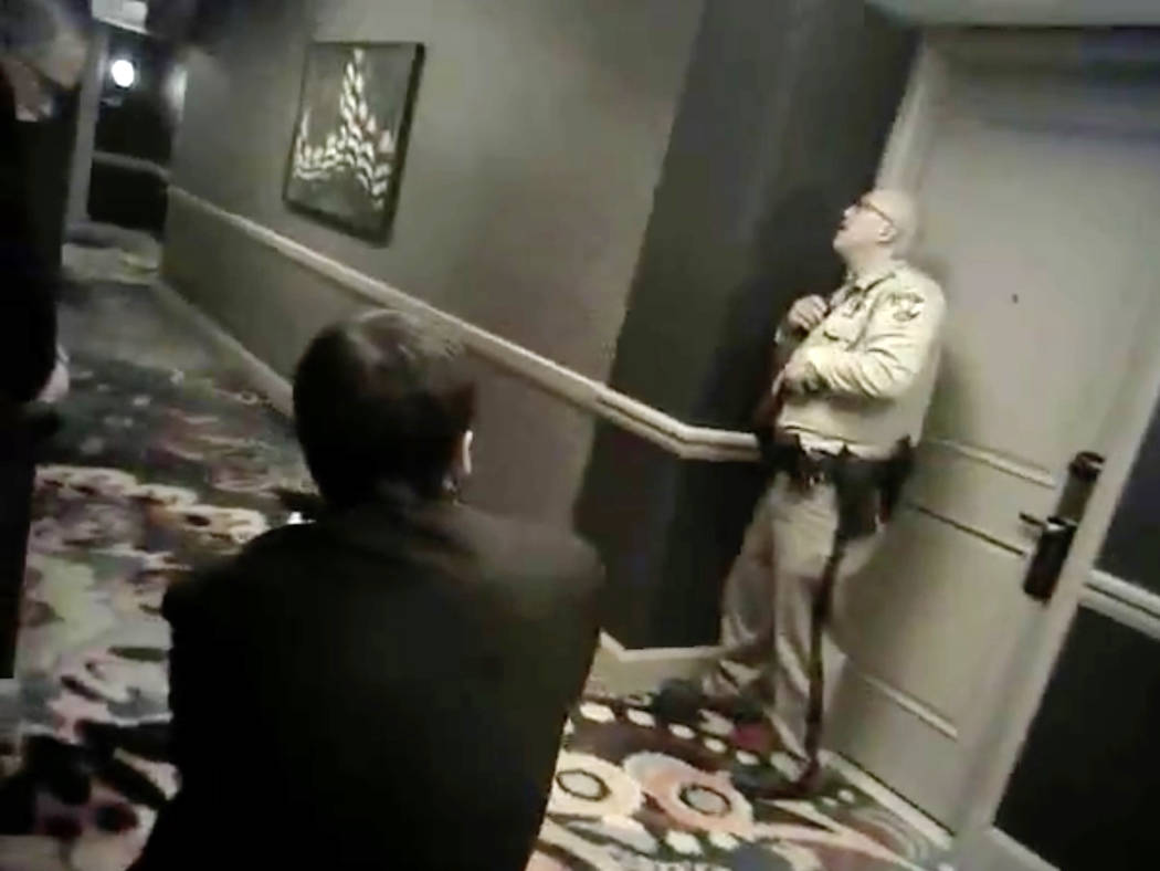 Newly released camera footage shows two Las Vegas police officers, paired with three armed Mandalay Bay security guards, holding their position in a hallway one floor beneath the Oct. 1 gunman for ...