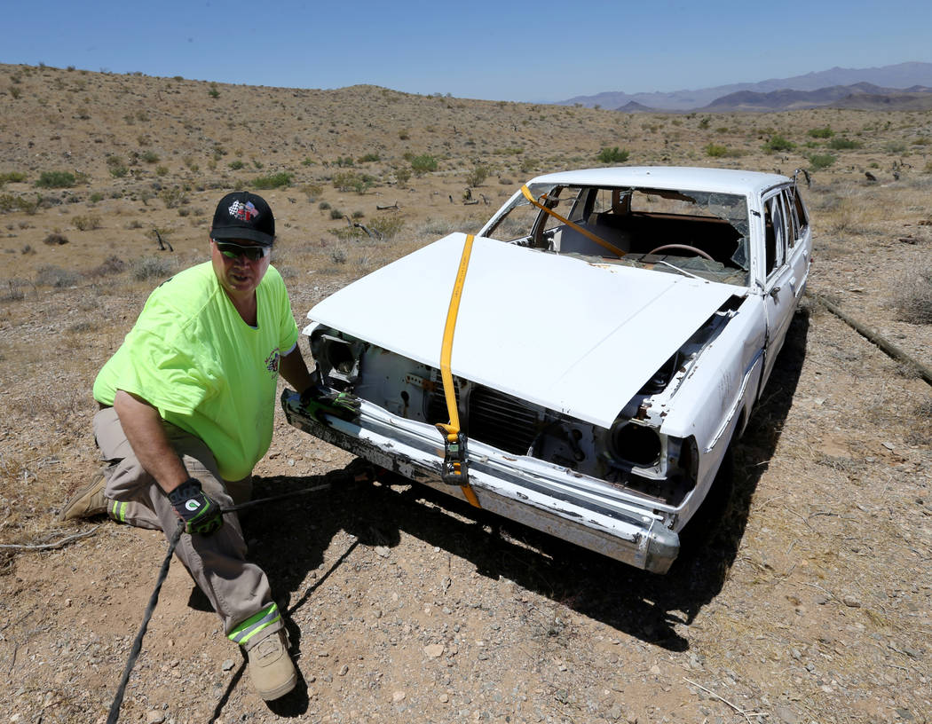 David Nehrbass, owner of Motor Sports Safety Solutions prepares to recover a car that belonged ...