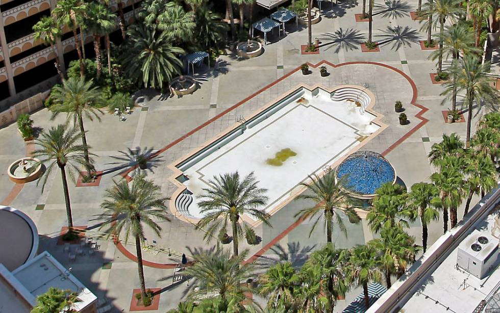 The Sahara hotel-casino pool sits empty in 2011, missing lounge chairs, most sold during the sa ...