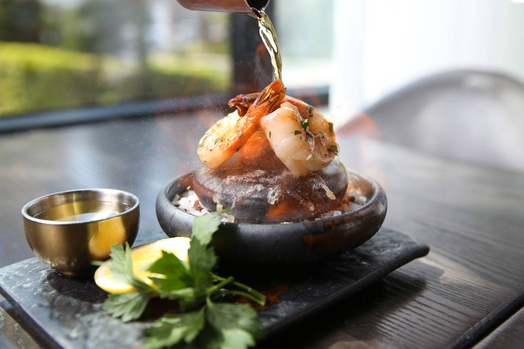 The scampi prawn flambe is served with garlic white wine sauce and drawn butter, at Gordon Ramsay Hell's Kitchen in Las Vegas, Tuesday, July 17, 2018. Erik Verduzco Las Vegas Review-Journal @Erik_ ...