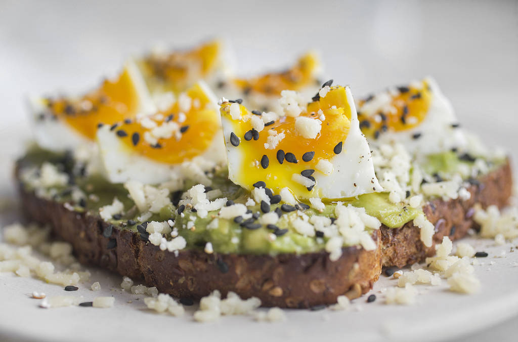 Crushed avocado toast with soft egg, black sesame and white cheddar at Flower Child on Friday, July 20, 2018, in Las Vegas. Benjamin Hager Las Vegas Review-Journal @benjaminhphoto