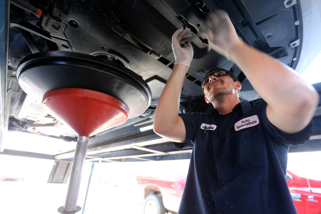 Lube technician Justice Erickson works on a car at Auto Specialists at 705 Juniper Way in Boulder City Wednesday, Aug. 1, 2018. K.M. Cannon Las Vegas Review-Journal @KMCannonPhoto