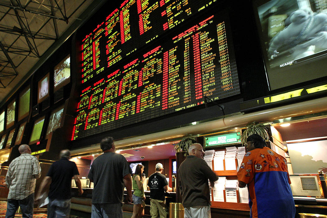 Bettors watch the NCAA Tournament boards at the Las Vegas Hilton (now the Westgate) in 2011. (Las Vegas Review-Journal)