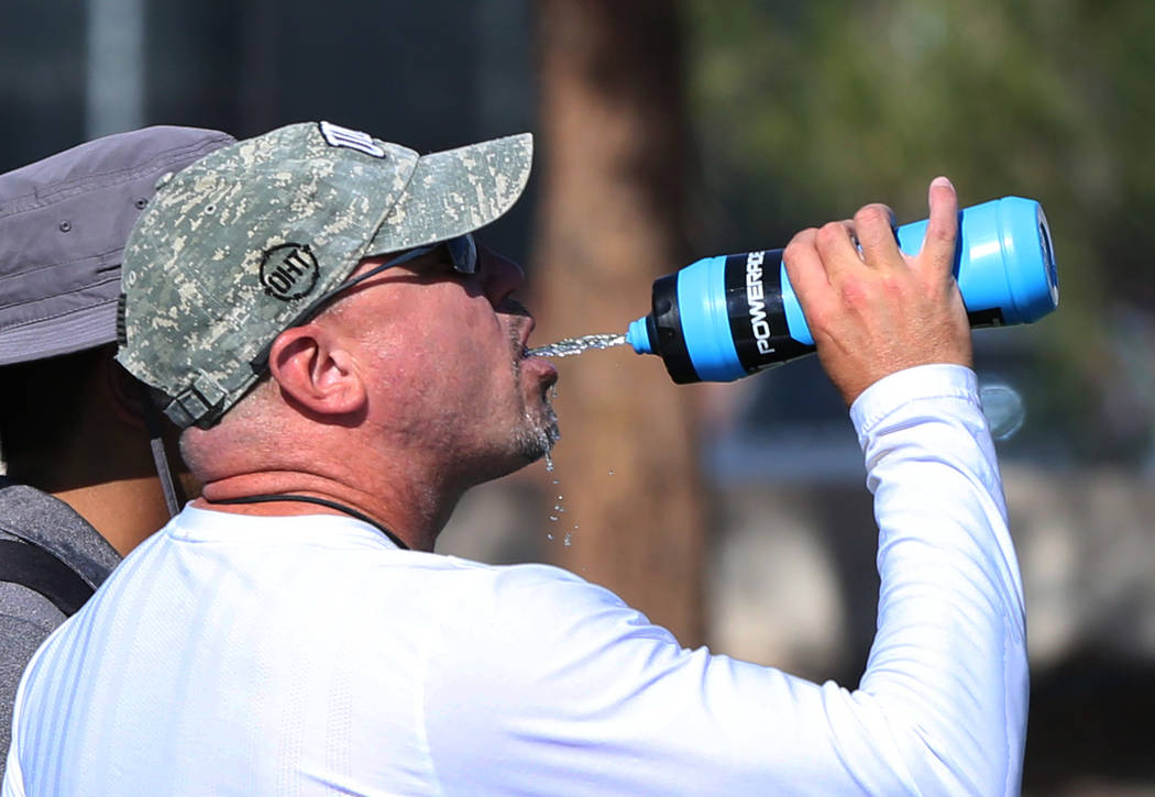 UNLV head coach Tony Sanchez, drinks water during team practice on Tuesday, Aug. 21, 2018, in Las Vegas. (Bizuayehu Tesfaye/Las Vegas Review-Journal) @bizutesfaye