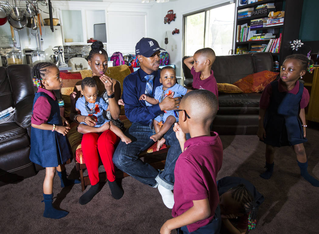 Deon Derrico, center, with wife, Karen Evonne Derrico, and some of their 11 children before pos ...