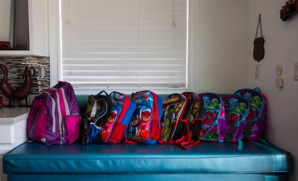 Backpacks belonging to the children of Deon Derrico at their home in North Las Vegas on Wednesd ...