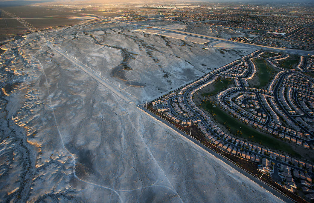 In this June 16, 2016, photo, a housing tract abuts the desert in Las Vegas. In Las Vegas, half-finished housing developments, relics of the housing boom, pockmark the surrounding desert. (AP Phot ...