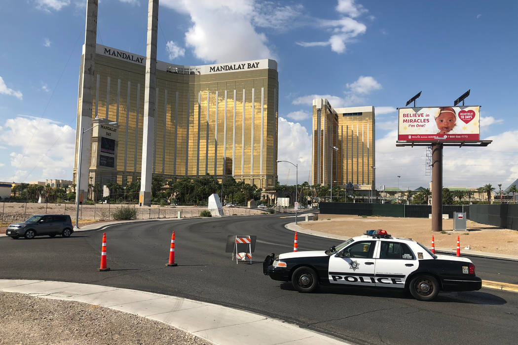 On Monday, Oct. 1, 2018, a police car blocks Giles Road behind the grounds where the Route 91 Harvest festival was held a year earlier. (Todd Prince/Las Vegas Review-Journal)