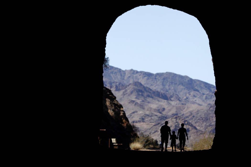 A family walks through a tunnel on the Historic railroad Trail in the Lake Mead National Recreation Area on Sunday, Feb. 23, 2014. High temperatures on Sunday were in the mid 70s and similar temp ...