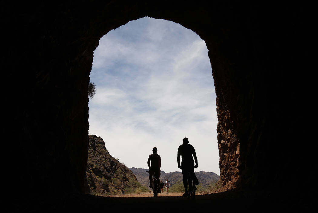 Rider bicycle through a tunnel along the Historic Railroad Trail near Lake Mead Tuesday, May 25, 2010. The popular biking and hiking trail, which is a spur off the 35-mile River Mountains Loop Tra ...