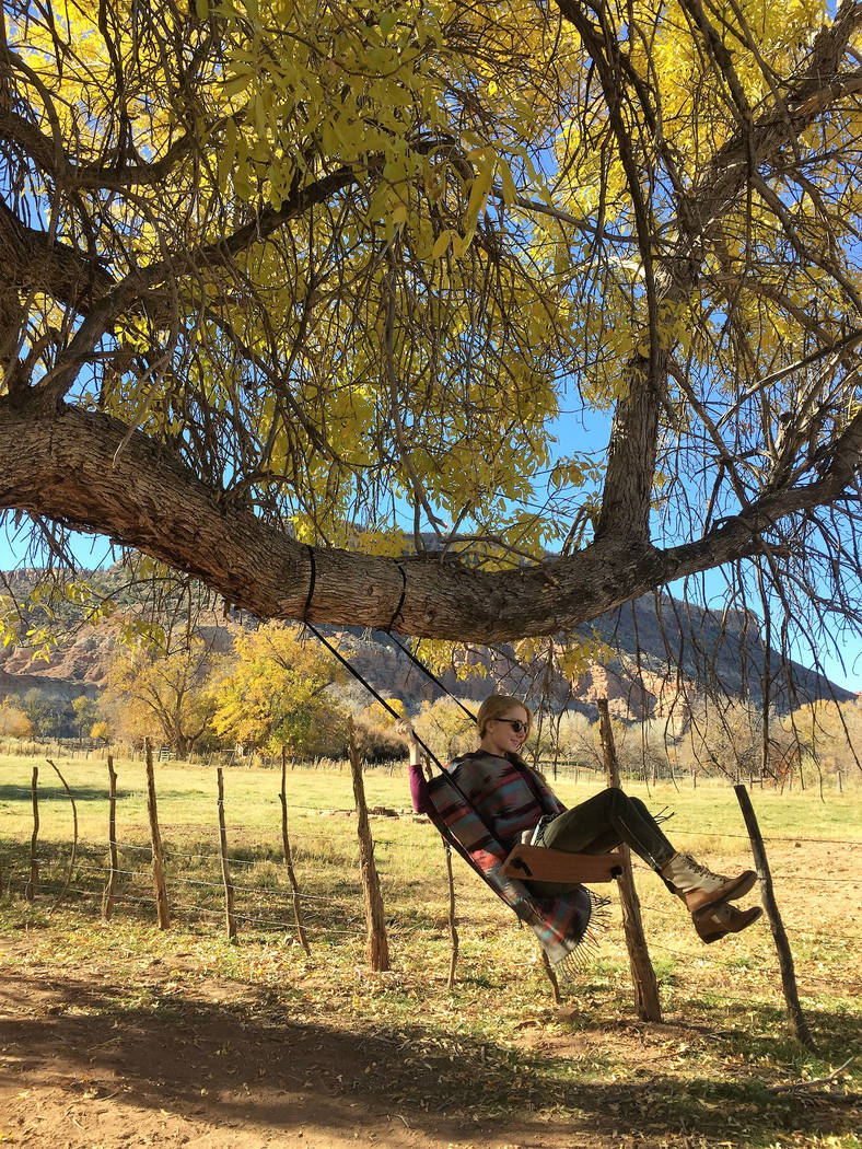 A visitor enjoying the tree swing in the yard of the 1879 Louisa Marie Russell Home in Grafton, Utah. (Deborah Wall/Las Vegas Review-Journal)