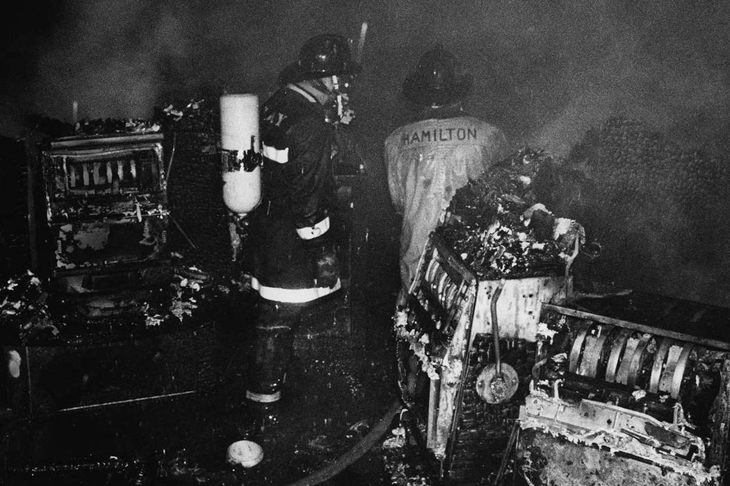 Clark County Firefighters survey the damage on the casino floor following the November 21, 1980 ...