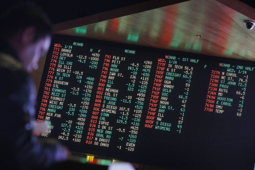 Odds are displayed on a screen at a sports book owned and operated by CG Technology in Las Vegas. (John Locher/AP)