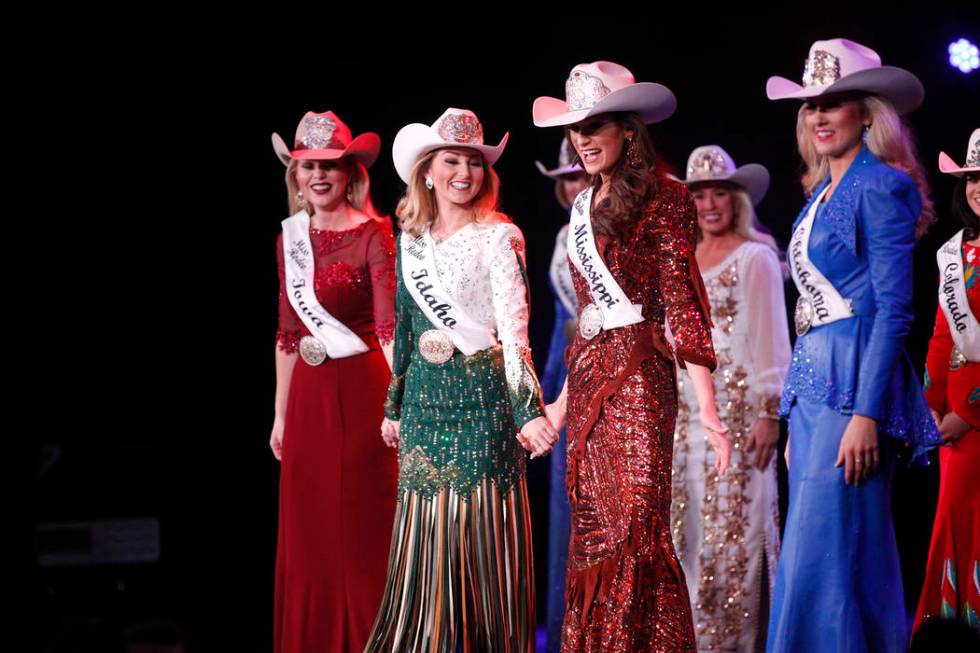 The final five contestants hold hands as they are announced at the Miss Rodeo America 2019 at t ...