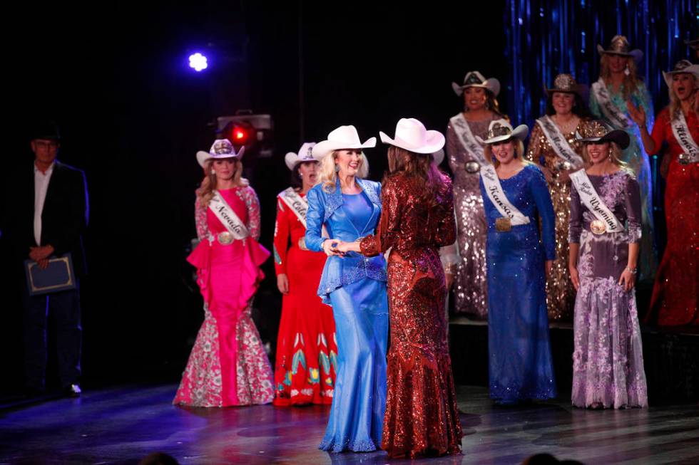 Miss Rodeo Oklahoma Taylor Spears, left, holds hands with Miss Rodeo Mississippi Taylor McNair ...