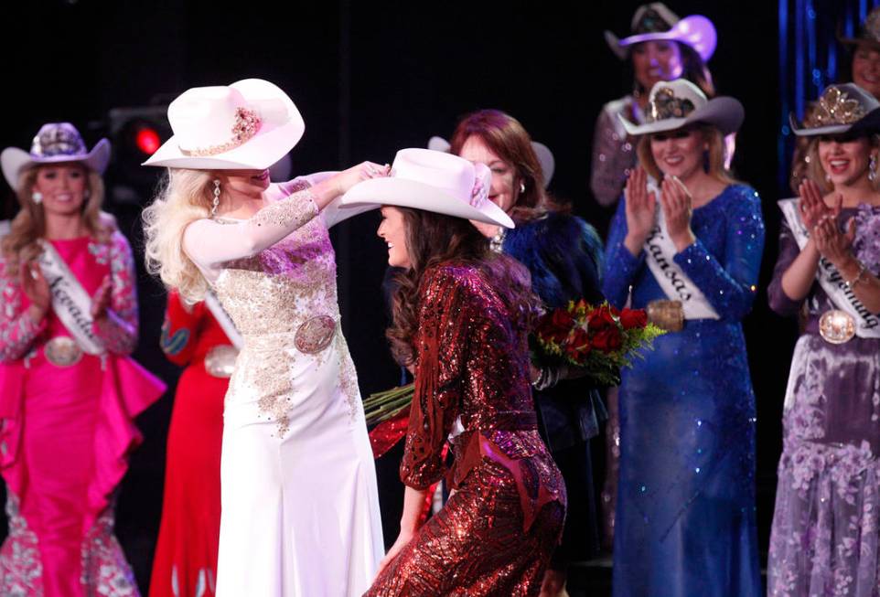 Miss Rodeo America 2018 Kerri Sheffield places a crown on the 2019 winner Miss Rodeo Mississipp ...