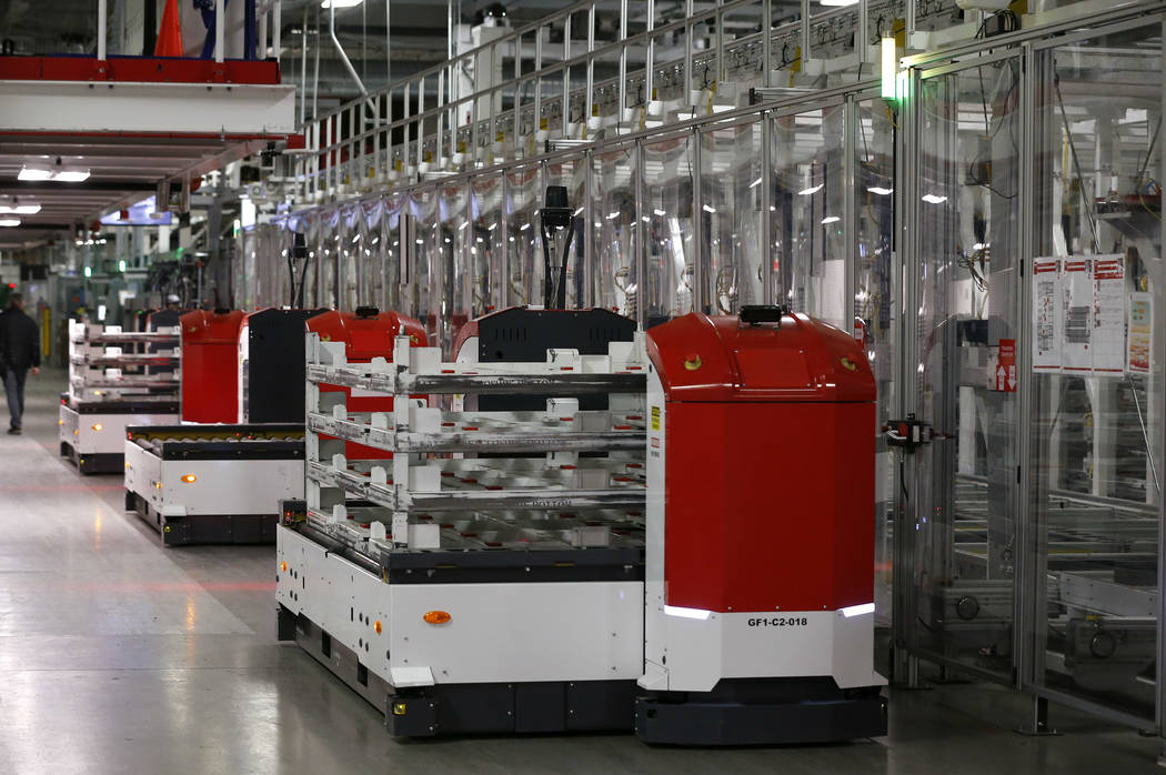 One of many robots works at the Tesla Gigafactory, east of Reno, Nev., on Tuesday, Dec. 4, 2018. Cathleen Allison Special to Las Vegas Review-Journal