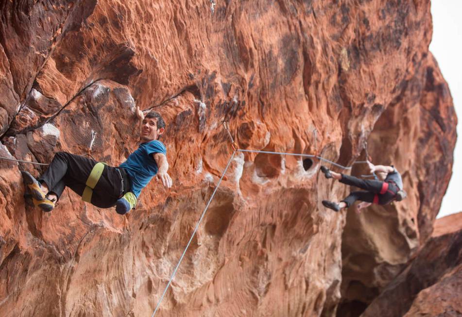 Alex Honnold, left, ascends The Gallery at Red Rock Canyon on Monday, Dec. 17, 2018, in Las Veg ...
