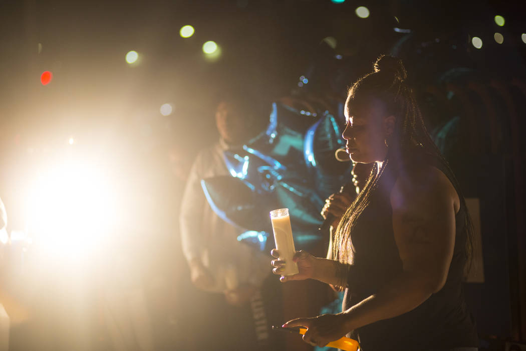 Annie Marshall holds a candle in memory of her son, Dalvin Brown, during a candlelight vigil ou ...