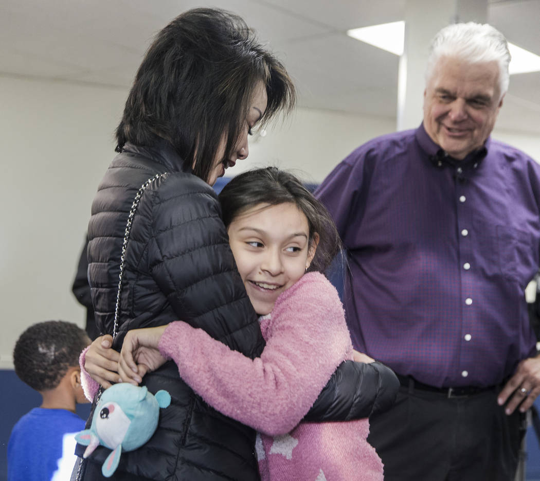 Karyme Hernandez, 11, hugs Kathy Sisolak during a visit to the Boys & Girls Clubs of Southern Nevada with her husband governor-elect Steve Sisolak on Thursday, Jan. 3, 2019, in Las Vegas. Benj ...