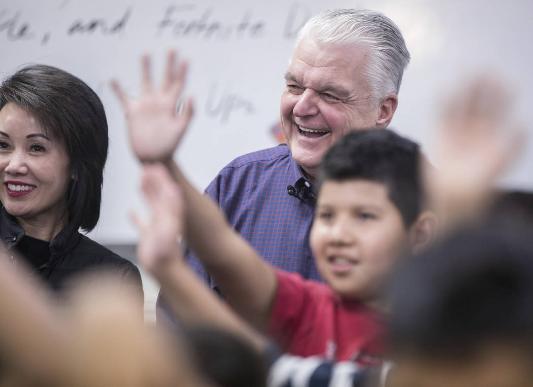 Governor-elect Steve Sisolak, right, and wife Kathy Sisolak laugh as kids wave to the cameras during a visit to the Boys & Girls Clubs of Southern Nevada on Thursday, Jan. 3, 2019, in Las Vega ...