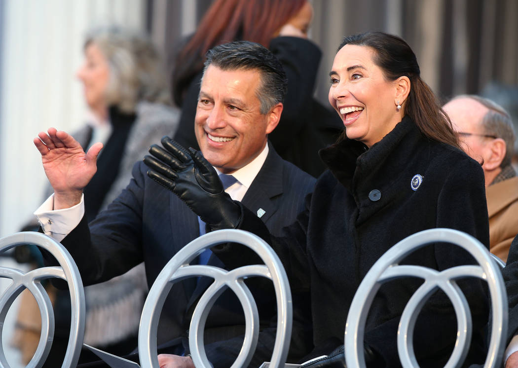 Former Gov. Brian Sandoval and his wife Lauralyn wave to members of the crowd before the inauguration at the Capitol, in Carson City, Nev., on Monday, Jan. 7, 2019. (Cathleen Allison/Las Vegas Rev ...