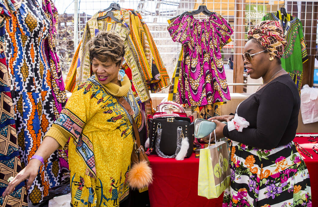 Beverly Williams helps Tiarra Kash pick out clothing from Handcraftivity Imports during a celebration of Black History Month at the Springs Preserve on Saturday, Feb. 17, 2018. Patrick Connolly L ...