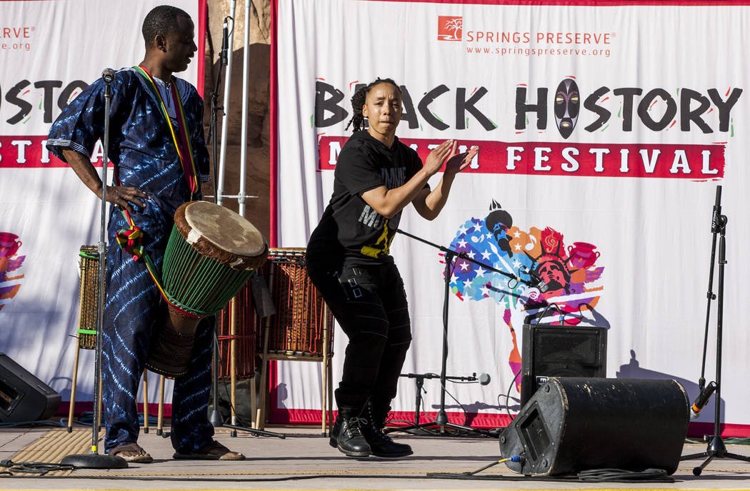 Drummer Samuel J. Wright watches as Angie Freeman of the performance group Molodi performs during a celebration of Black History Month at the Springs Preserve on Saturday, Feb. 17, 2018. Patrick ...