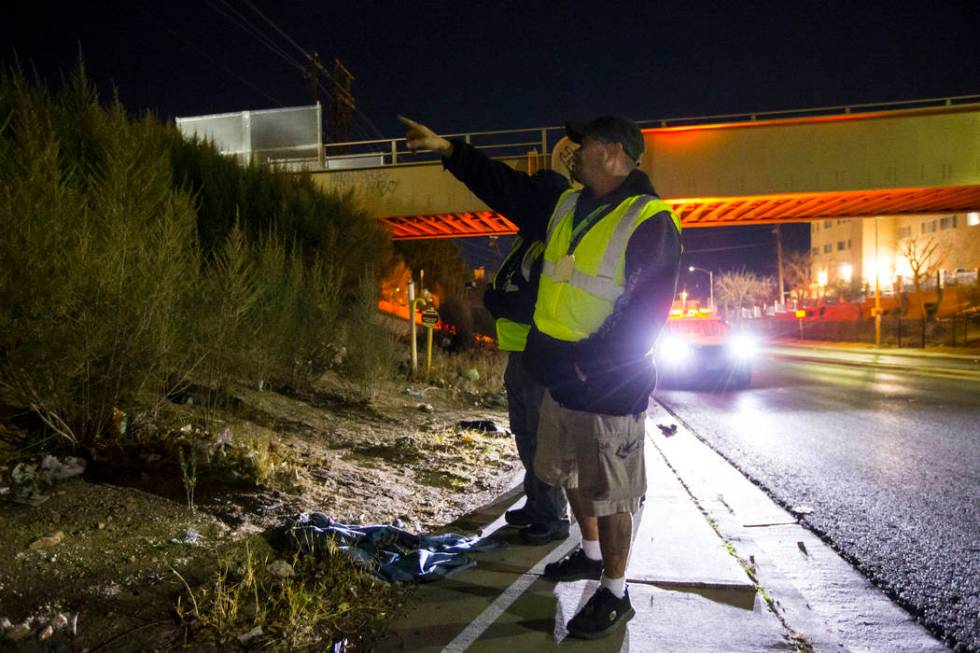 William Kight, center, looks for homeless people during the annual Southern Nevada Homeless Cen ...